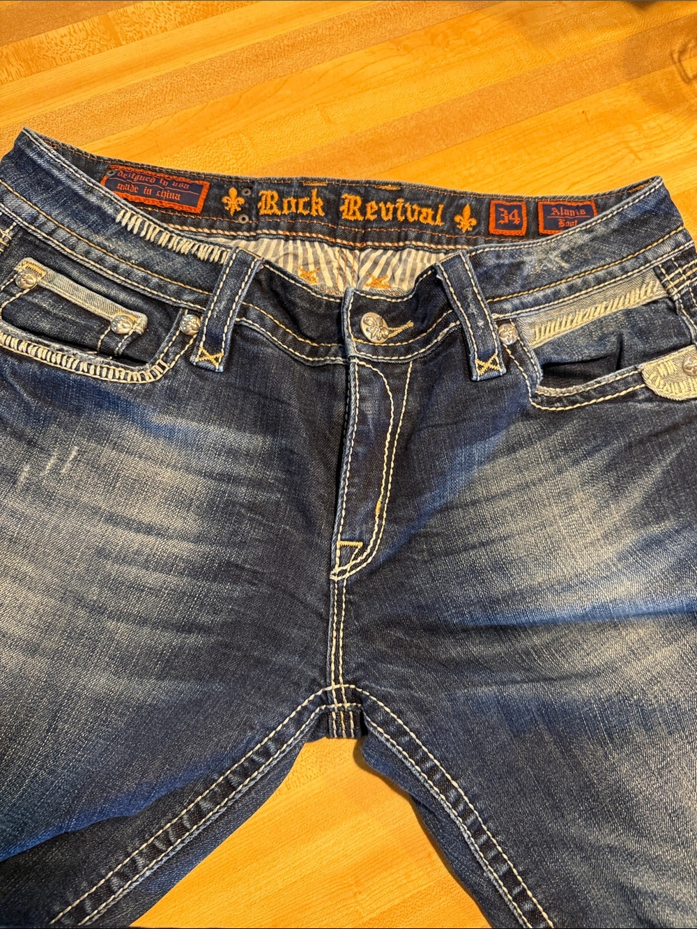 Rock Revival Distressed Indigo Jeans with Contrast Stitching